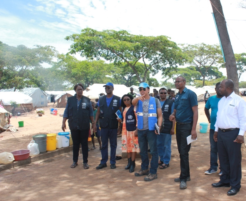The WHO Representative, Dr. Nathan Bakyaita  (second from left), accompanied by WHO National Surveillance Officers and the Disease Prevention and Control Officer on a conducted tour of Mantampala Refugee Camp