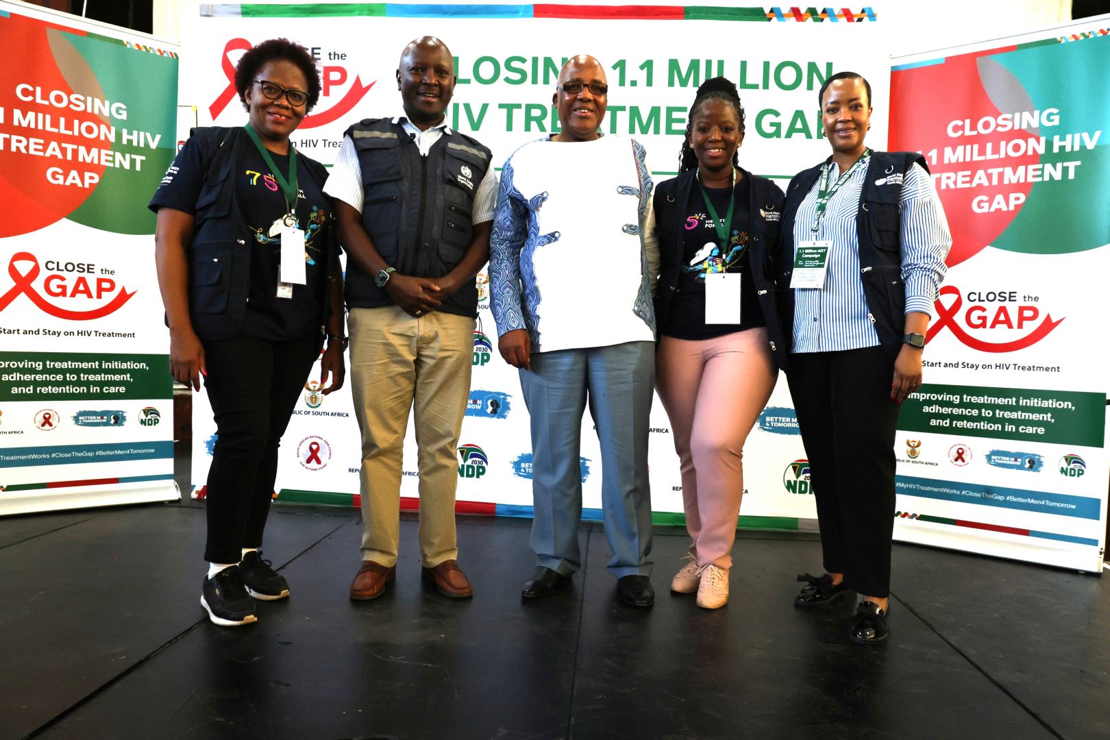 WHO staff with Minister of Health, Dr Aaron Motsoaledi (middle) during the Closing 1.1 Million HIV Treatment Gap Campaign at Chris Hani Baragwanath Hospital in Johannesburg