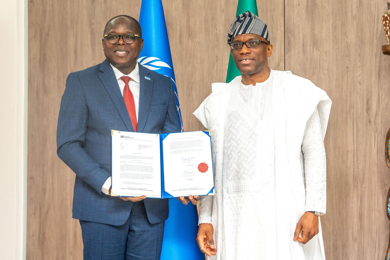 Dr. Kouamé Jean KONAN, WHO Representative, officially presenting his credentials to His Excellency Mr. Olushegun Adjadi BAKARI, Minister of Foreign Affairs of the Republic of Benin