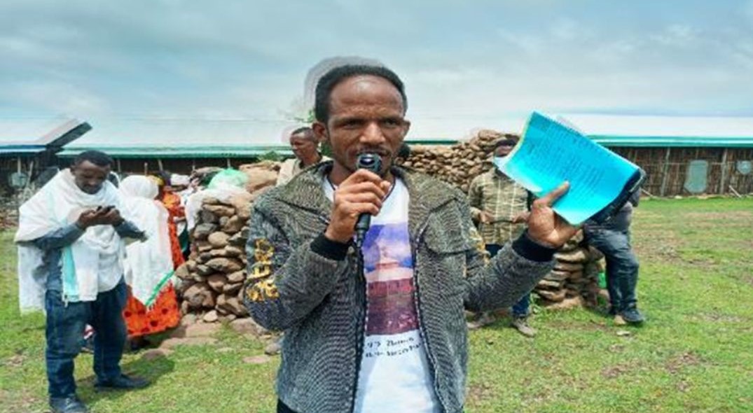 Melkamu conducting community sensitization on disease prevention and surveillance