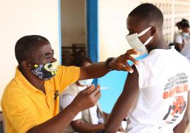 Mobile vaccination team vaccinating community members in Nimba county.