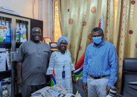 Dr. Jane Maina (center) with the Honorable Minister of Health, Dr. Ahmadou L. Samateh (right)