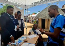 Looking on Minister of Sport & Arts, Jacob Kelebeng and WHO Botswana OIC, Dr. Juliet Bataringaya