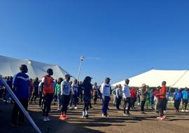 Attendees participating in a pre-event exercise session