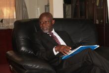 Hon. Minister keenly listening to the WHO Representative after receiving materials on the work of WHO