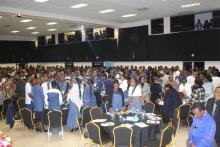 Delegates observing a moment of silence for departed Nurses