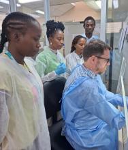 Technicians demonstrating how testing is done