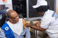 NPHIL Director General, Dr. Dugbeh Nyan receiving the vaccine