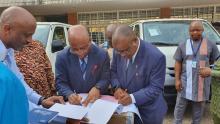 WR & Minister signing hand over note
